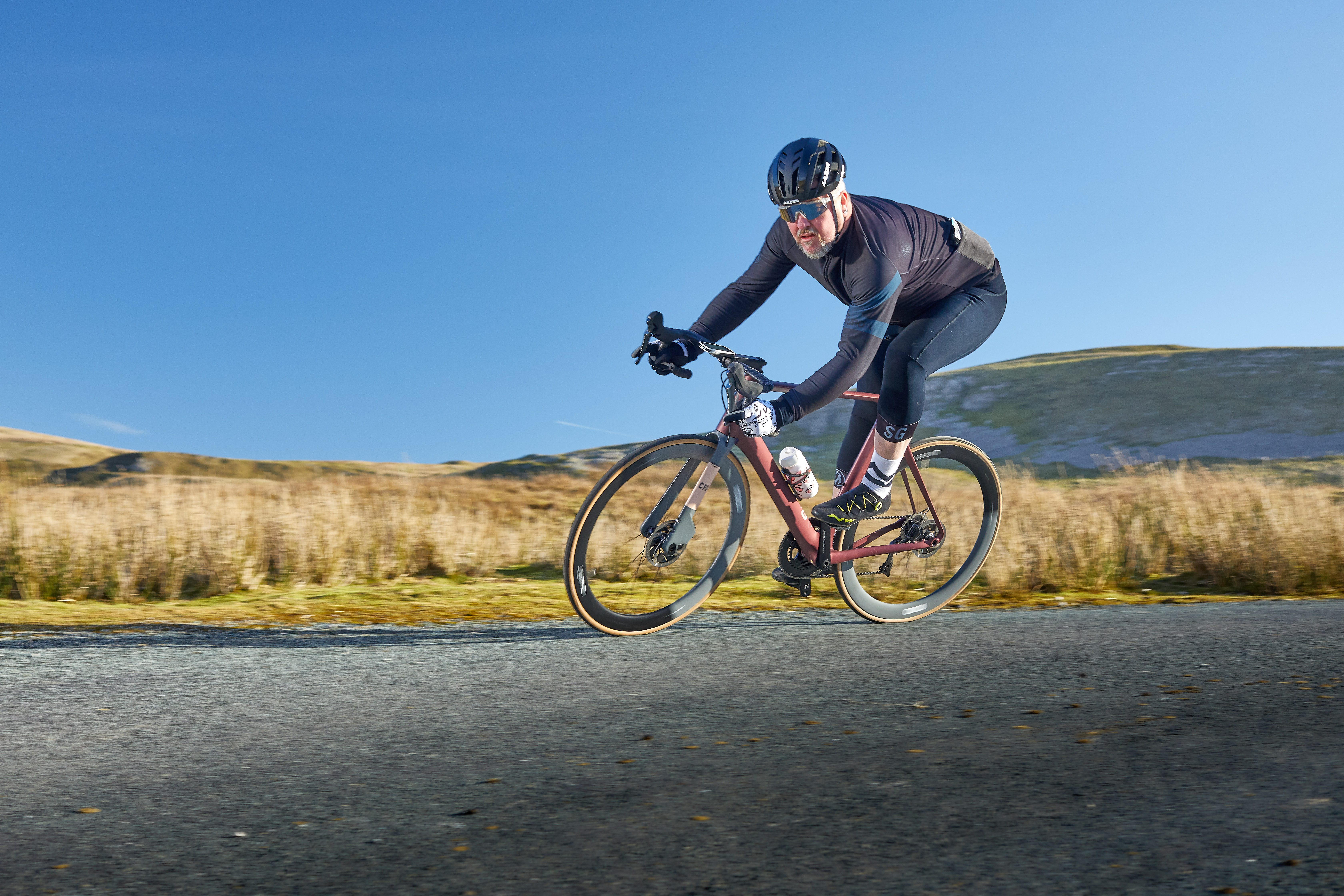 A road cyclist takes a corner on the Rondo HVRT CF01, Bikeradar's road Bike of the Year 2019
