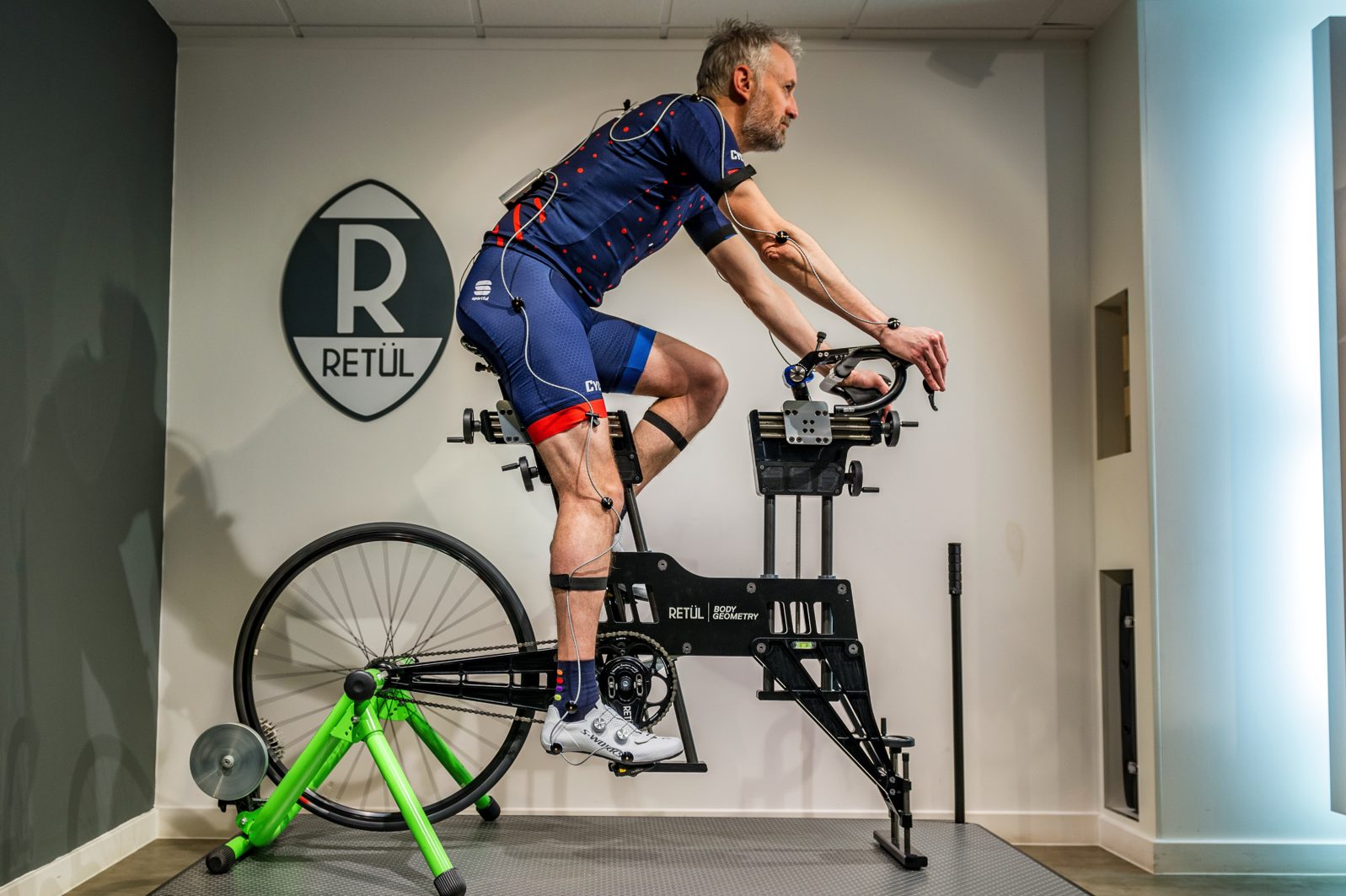 Man on bike fitting machine